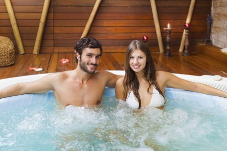 Smiling couple relaxing in a whirlpool